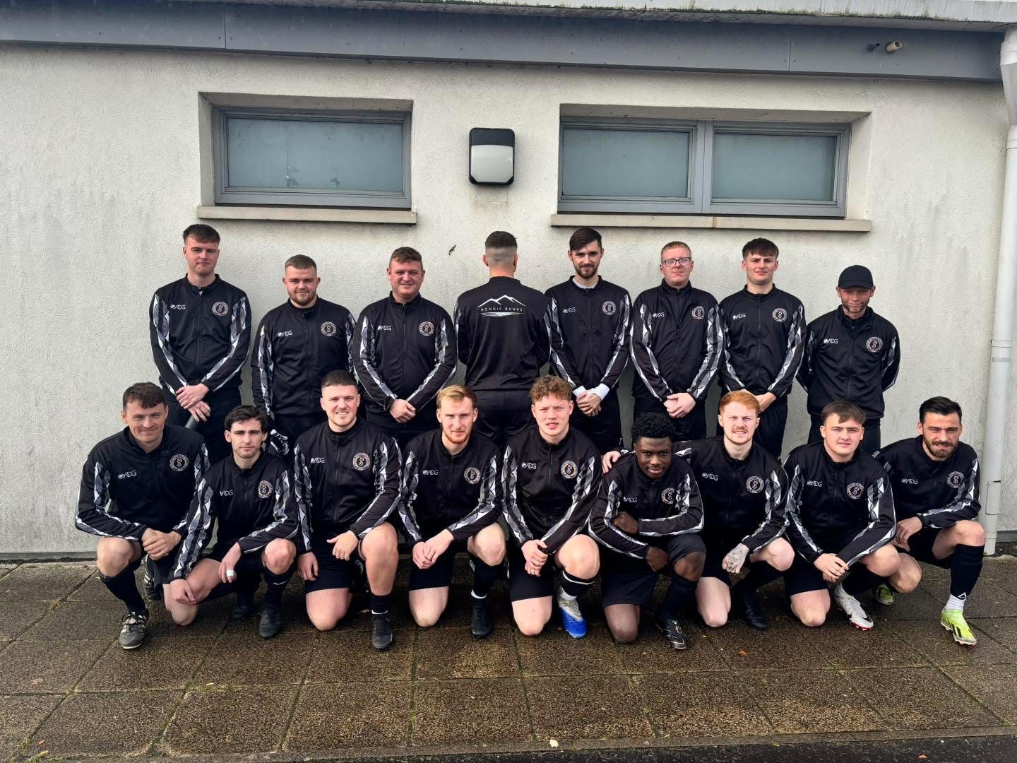 Team wearing ADG kit – yellow and blue diagonal sash design